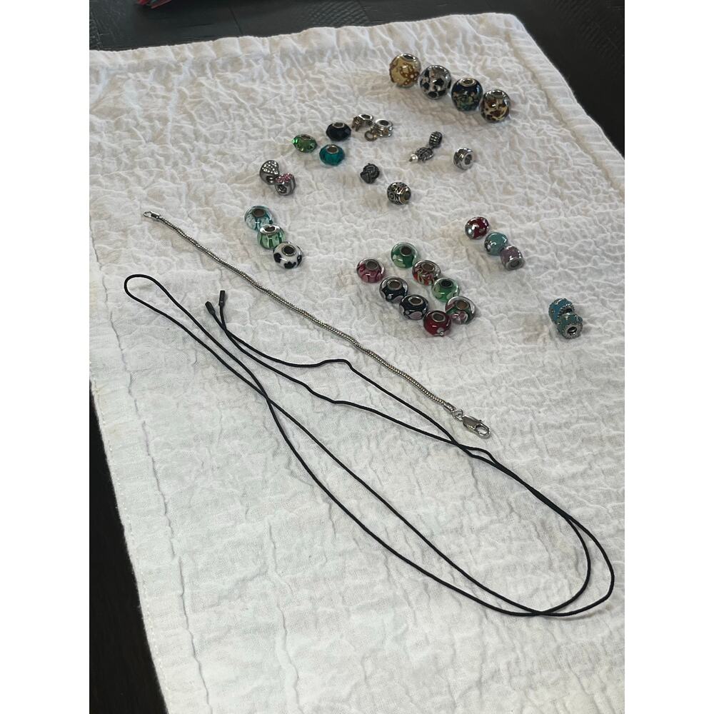 31 slide charms unknown maker - some have makers mark + bracelet + Pandora cord